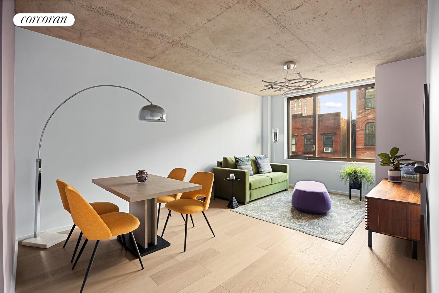 196 Orchard Street, Unit 5K Manhattan, NY 10002 - Photo 1 of 8 a living room with furniture and a potted plant