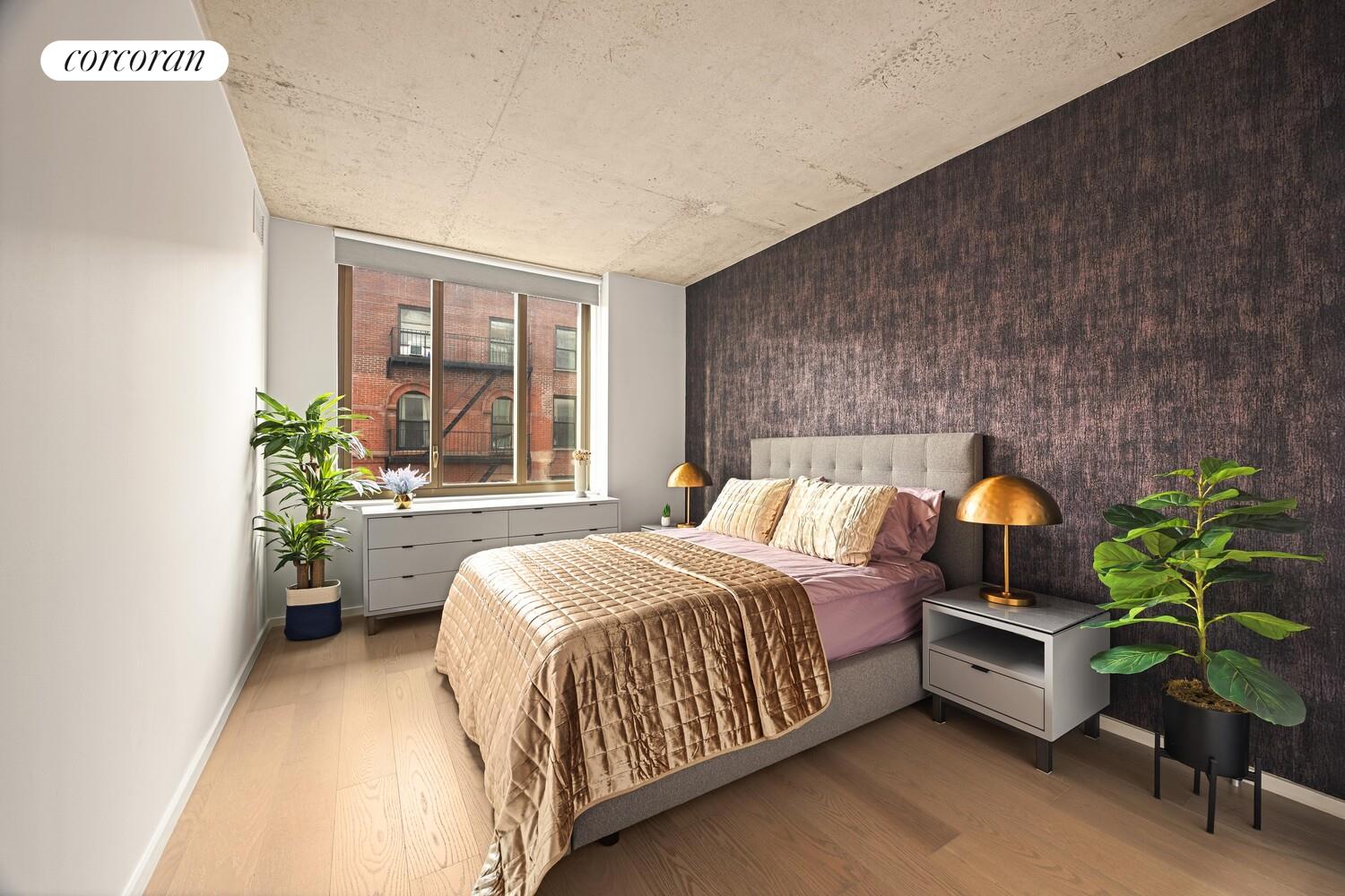 196 Orchard Street, Unit 5K Manhattan, NY 10002 - Photo 7 of 8 a bedroom with a bed table flowerpot and window