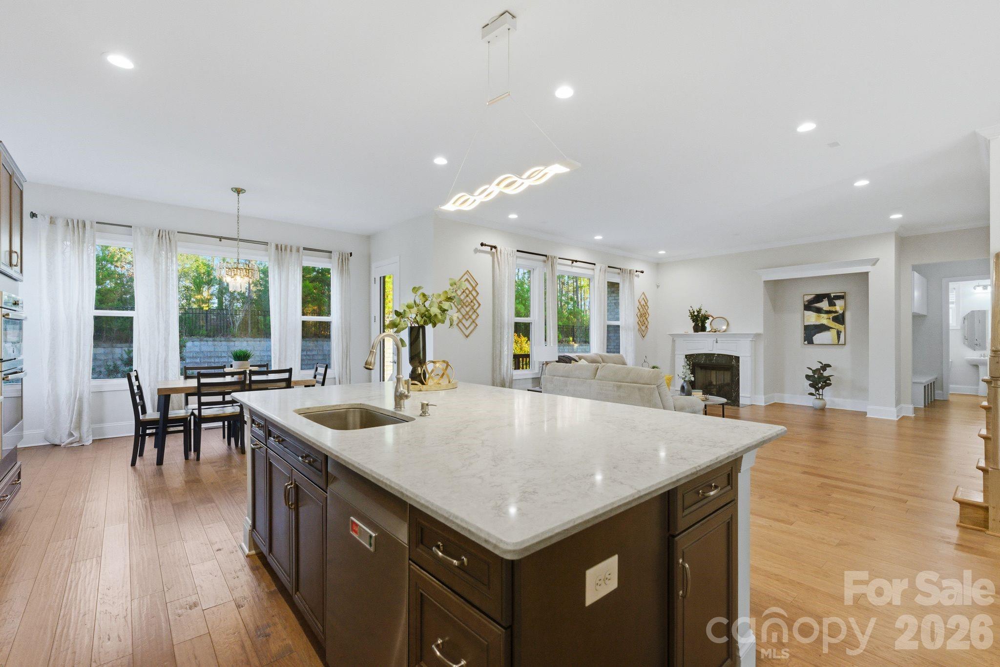374 Hampton Trail Drive Fort Mill, SC 29708 - Photo 12 of 46 an open kitchen with a table and chairs