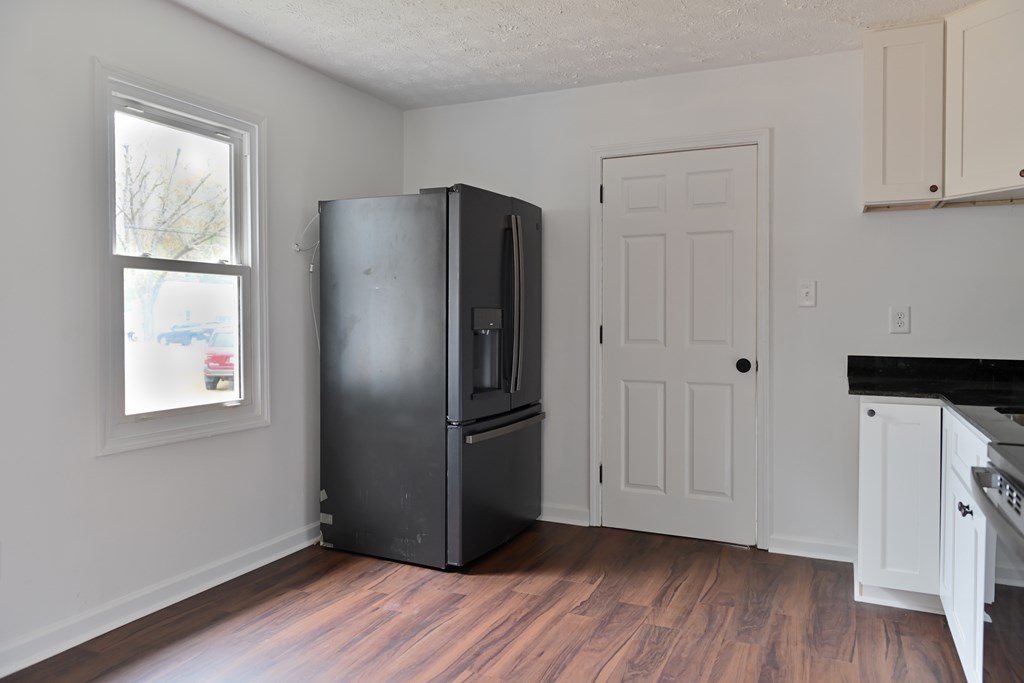 3946 Forestside Drive Columbus, GA 31907 - Photo 3 of 20 a view of an empty room with wooden floor and a window