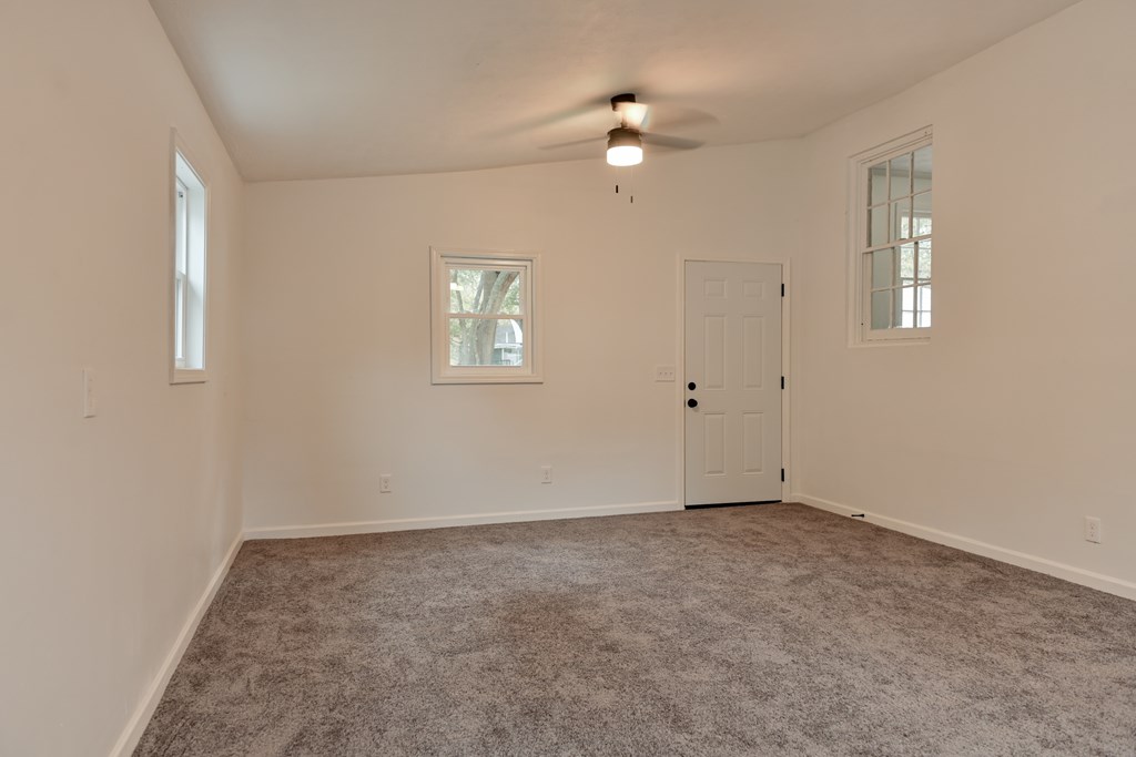 3946 Forestside Drive Columbus, GA 31907 - Photo 5 of 20 a view of an empty room with a chandelier fan