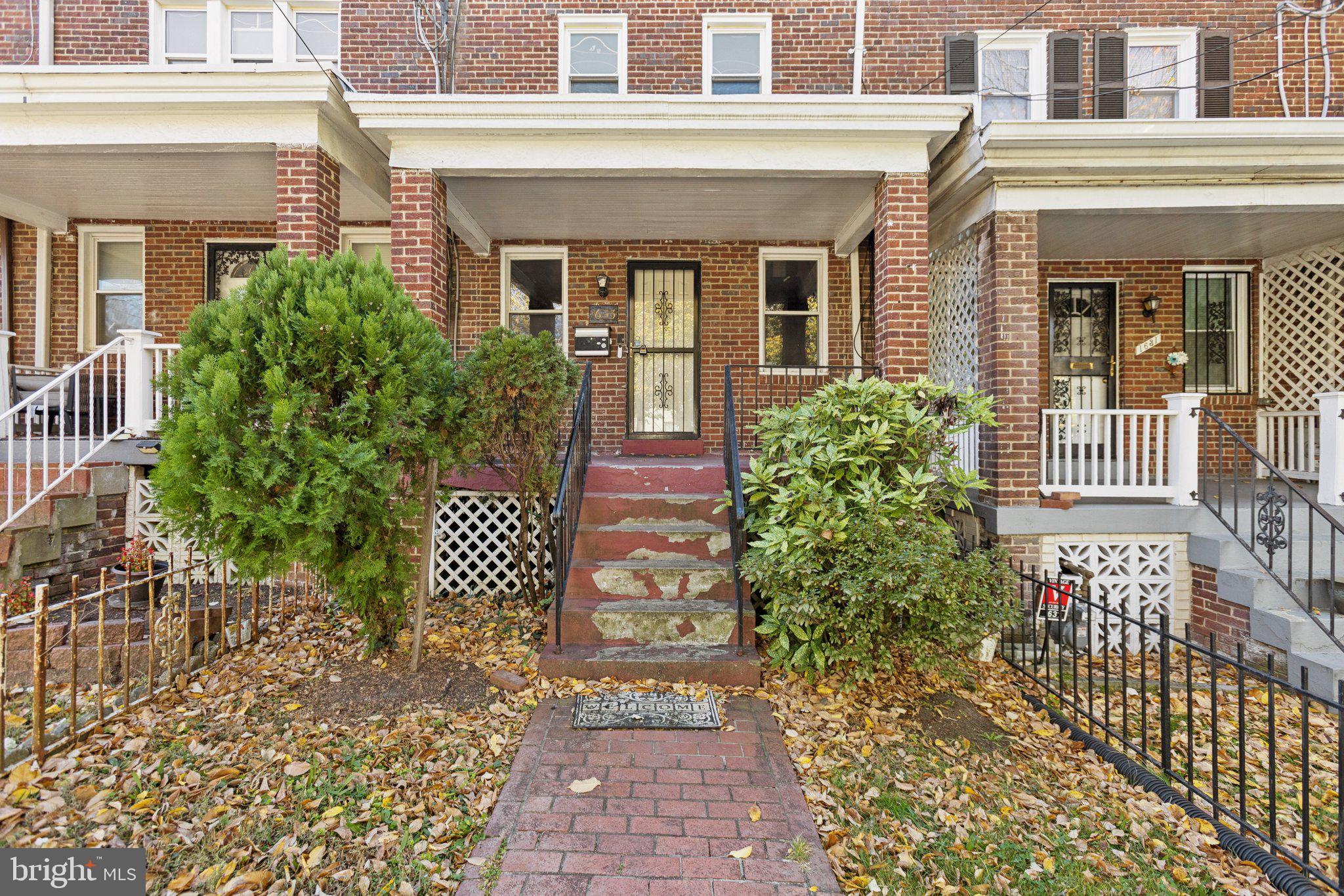 1633 R Street Southeast Washington, DC 20020 - Photo 41 of 44 front view of a brick house with a large window