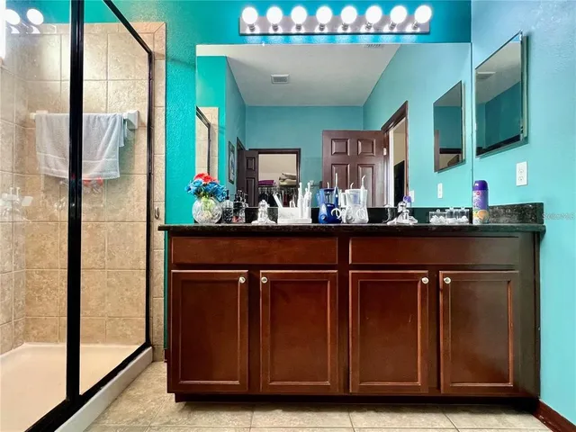 a kitchen with a sink and a refrigerator