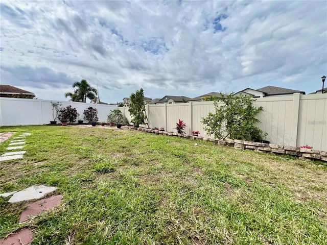 a big yard with table and chairs