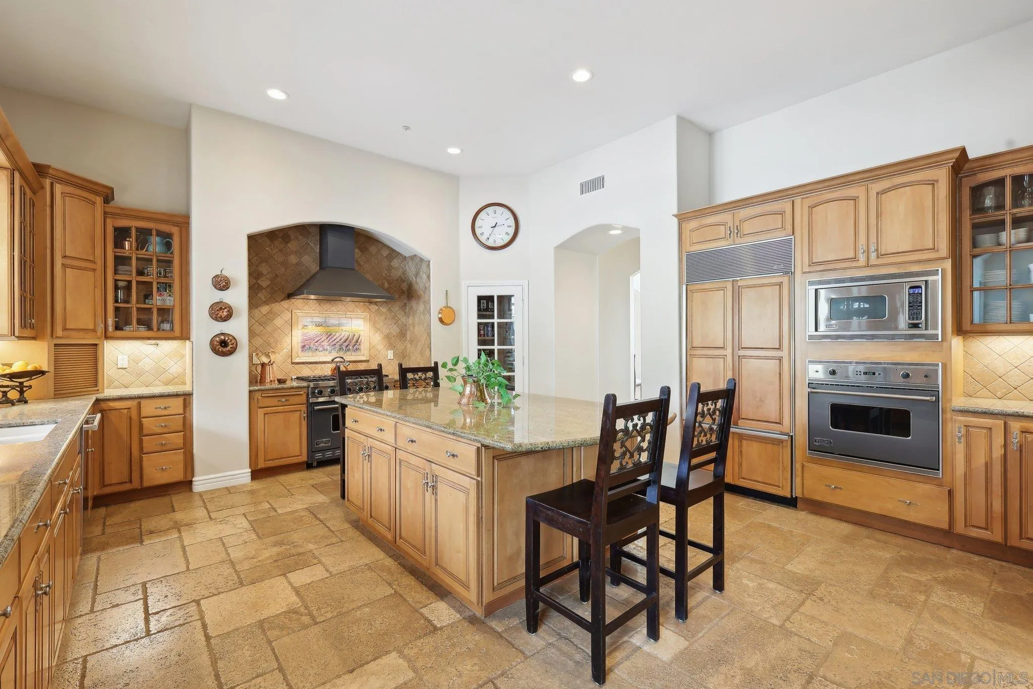 17702 Old Winery Way Poway, CA 92064 - Photo 23 of 75 a kitchen with stainless steel appliances a stove a sink and a refrigerator