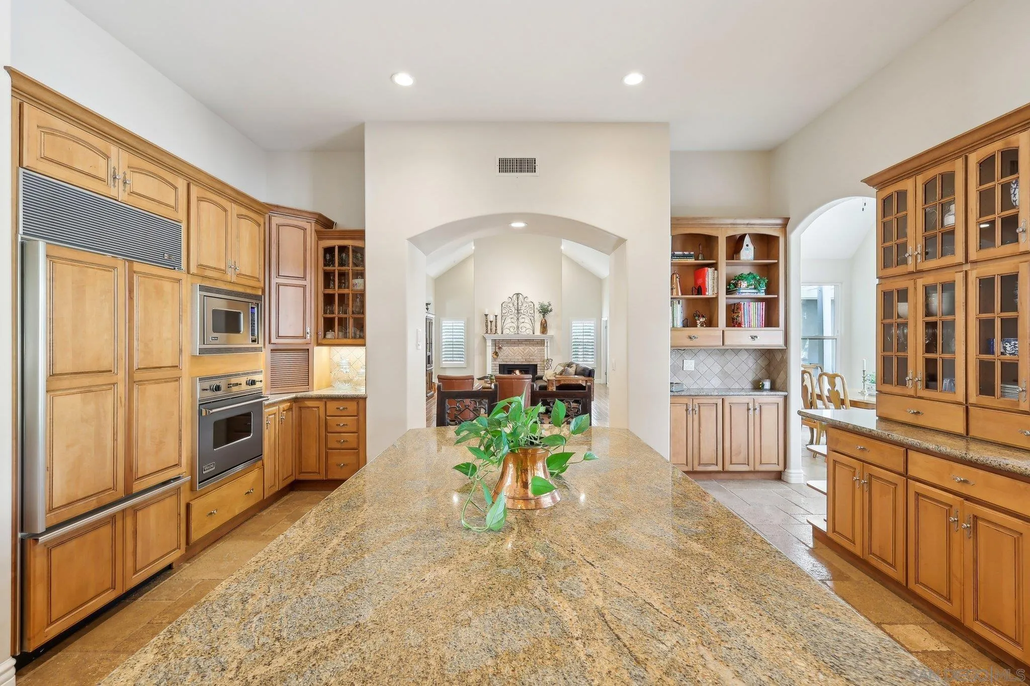 17702 Old Winery Way Poway, CA 92064 - Photo 25 of 75 a view of a kitchen with stainless steel appliances granite countertop a refrigerator a stove and a wooden floors