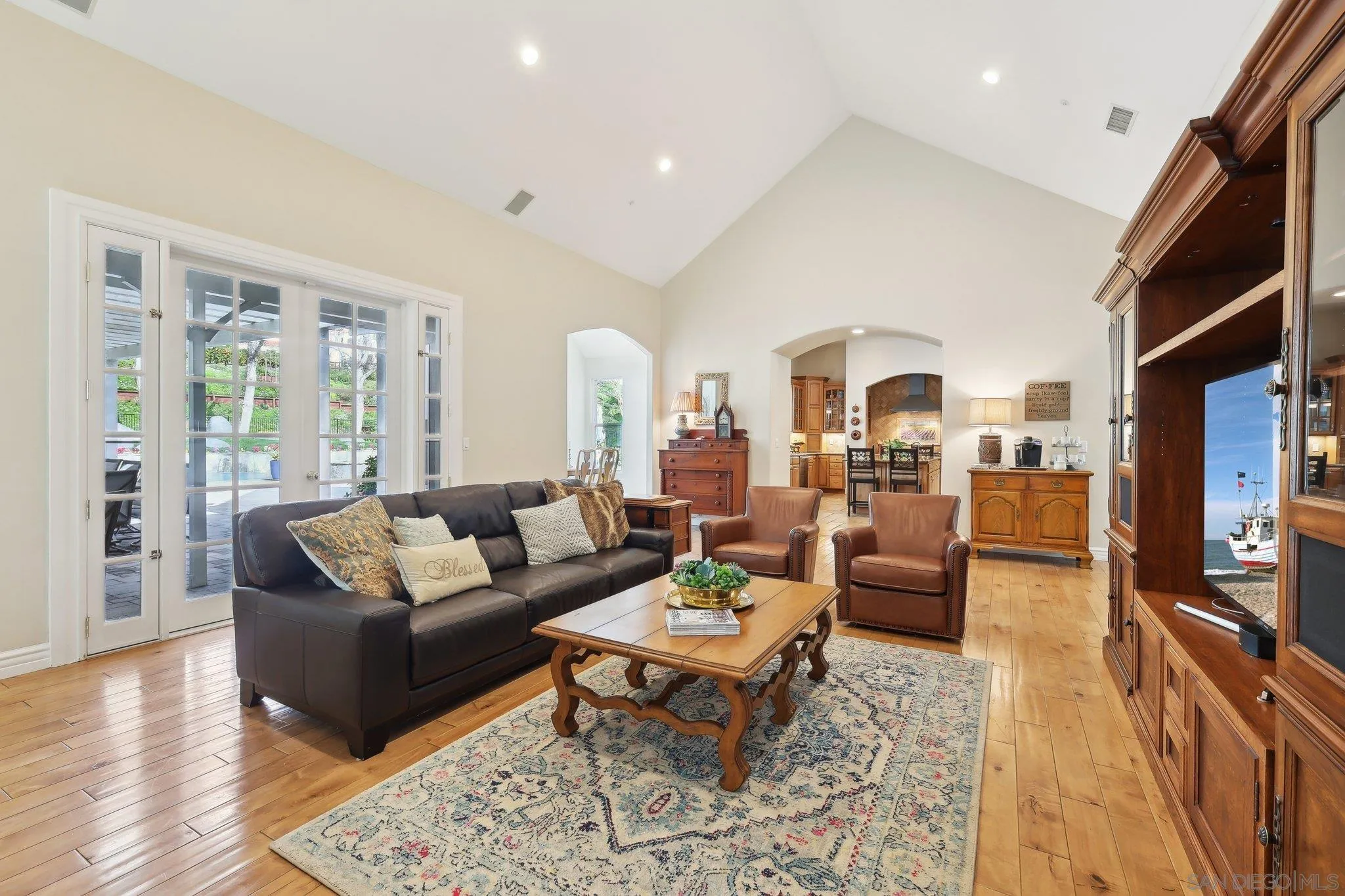 17702 Old Winery Way Poway, CA 92064 - Photo 29 of 75 a living room with furniture fireplace and a table