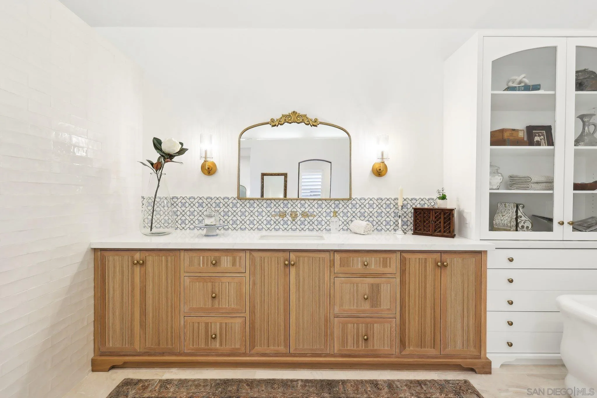 17702 Old Winery Way Poway, CA 92064 - Photo 37 of 75 a bathroom with a sink and a mirror