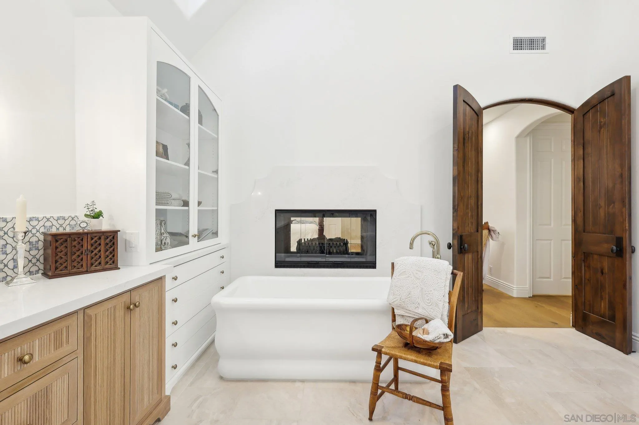 17702 Old Winery Way Poway, CA 92064 - Photo 41 of 75 a living room with furniture a flat screen tv and a floor to ceiling window