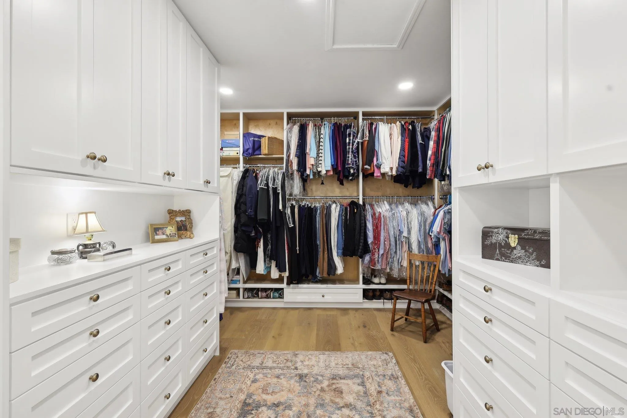 17702 Old Winery Way Poway, CA 92064 - Photo 44 of 75 a view of walk in closet with clothes and shoes