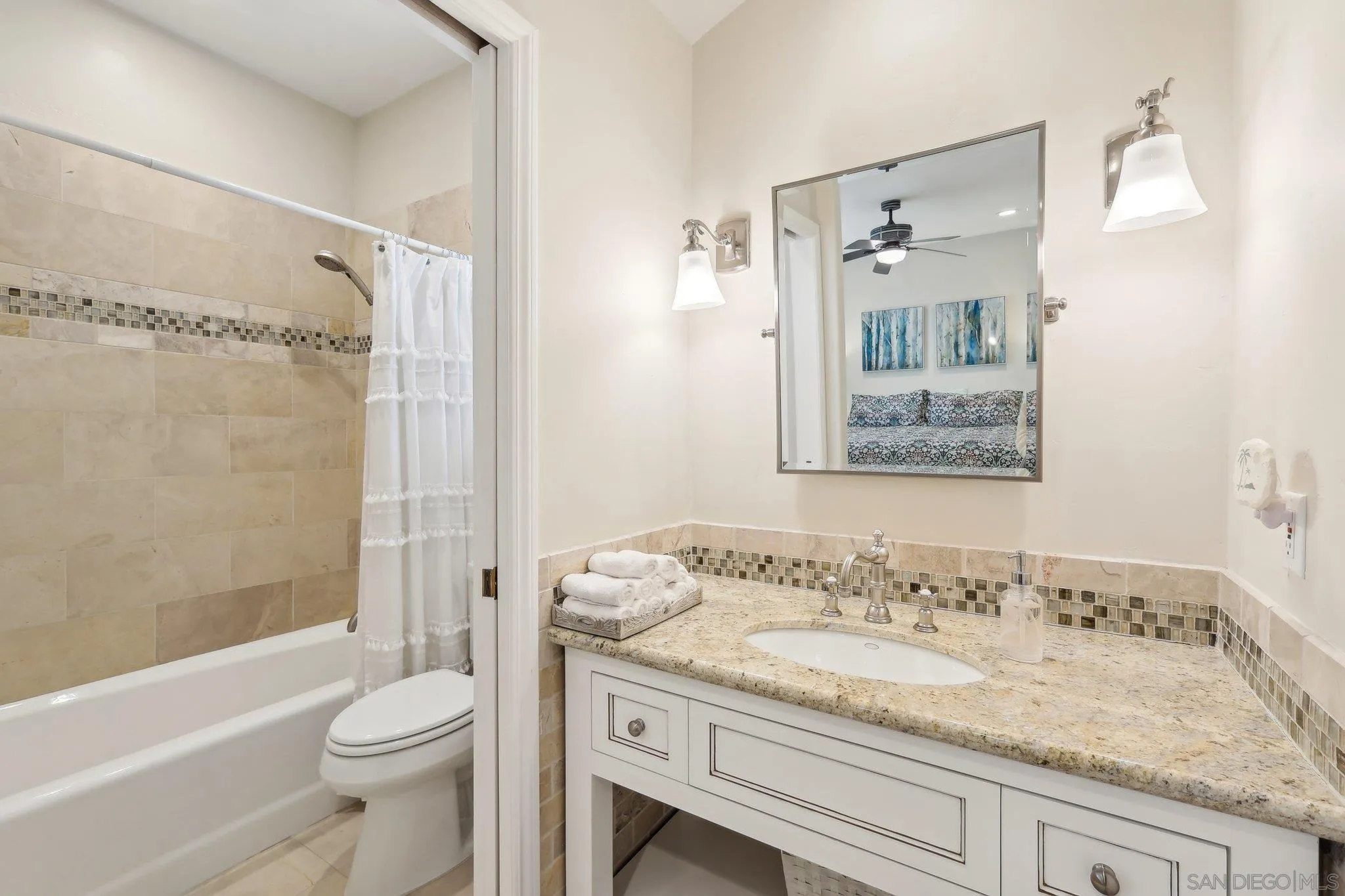 17702 Old Winery Way Poway, CA 92064 - Photo 53 of 75 a bathroom with a granite countertop sink a toilet and shower