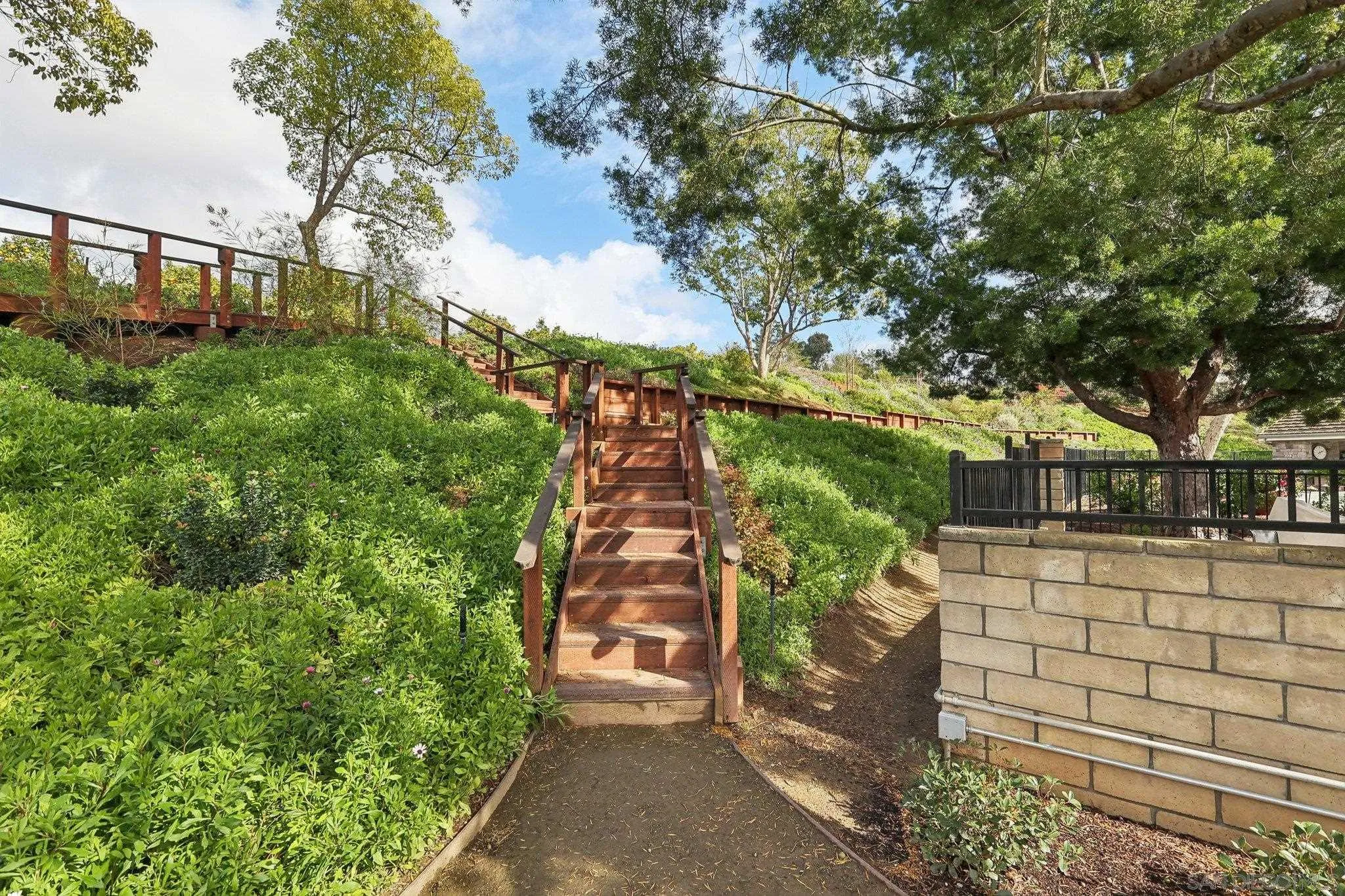 17702 Old Winery Way Poway, CA 92064 - Photo 65 of 75 a view of a yard with plants and large trees