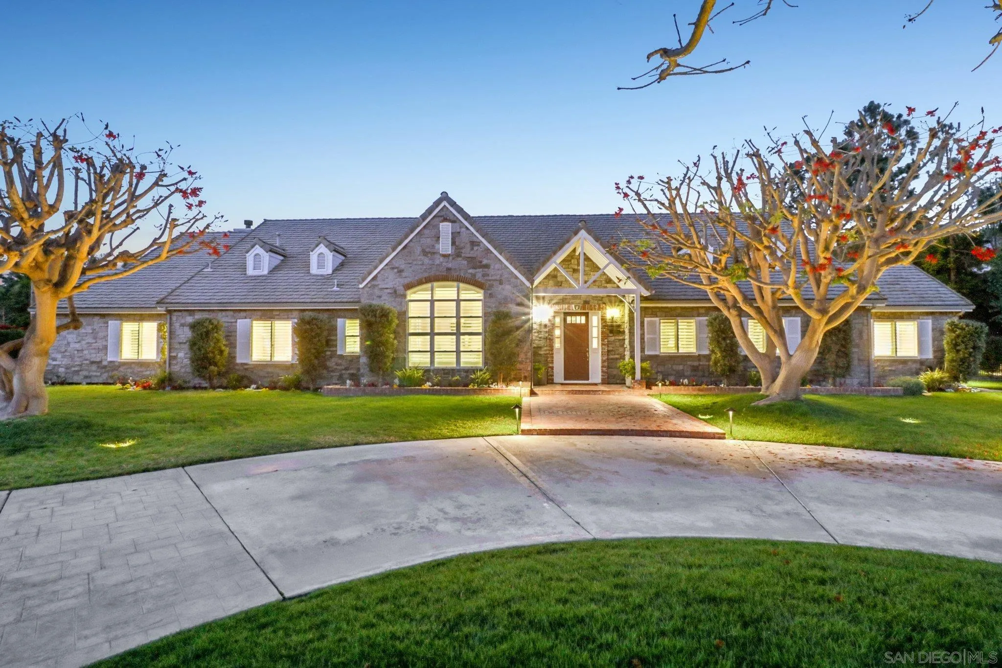 17702 Old Winery Way Poway, CA 92064 - Photo 9 of 75 a front view of a house with a yard and garage
