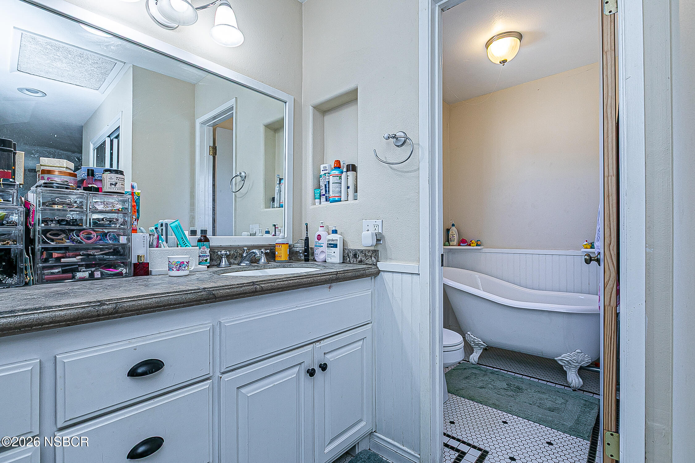 712 Pebble Beach Place Santa Maria, CA 93454 - Photo 24 of 31 a bathroom with a sink and a mirror