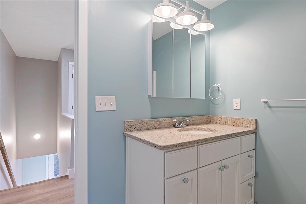 74 Hill Road, Unit B Charlton, MA 01507 - Photo 16 of 23 a bathroom with a sink vanity and mirror