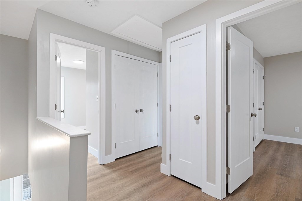 74 Hill Road, Unit B Charlton, MA 01507 - Photo 8 of 23 a view of a hallway with wooden floor
