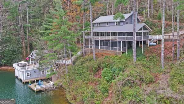 an aerial view of a house with a yard