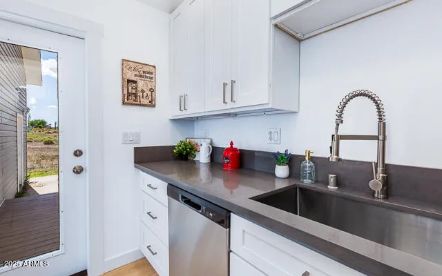 a kitchen with stainless steel appliances granite countertop a stove and a microwave