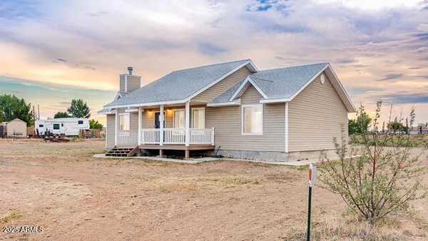 a house with yard in front of it