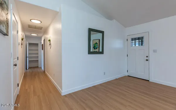 a view of an empty room with a window