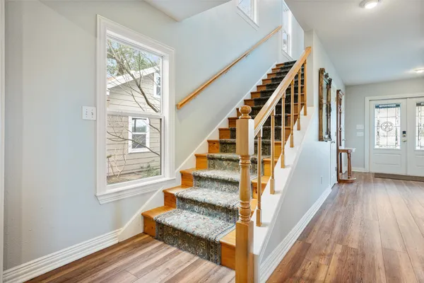 a view of a house with a yard and garage