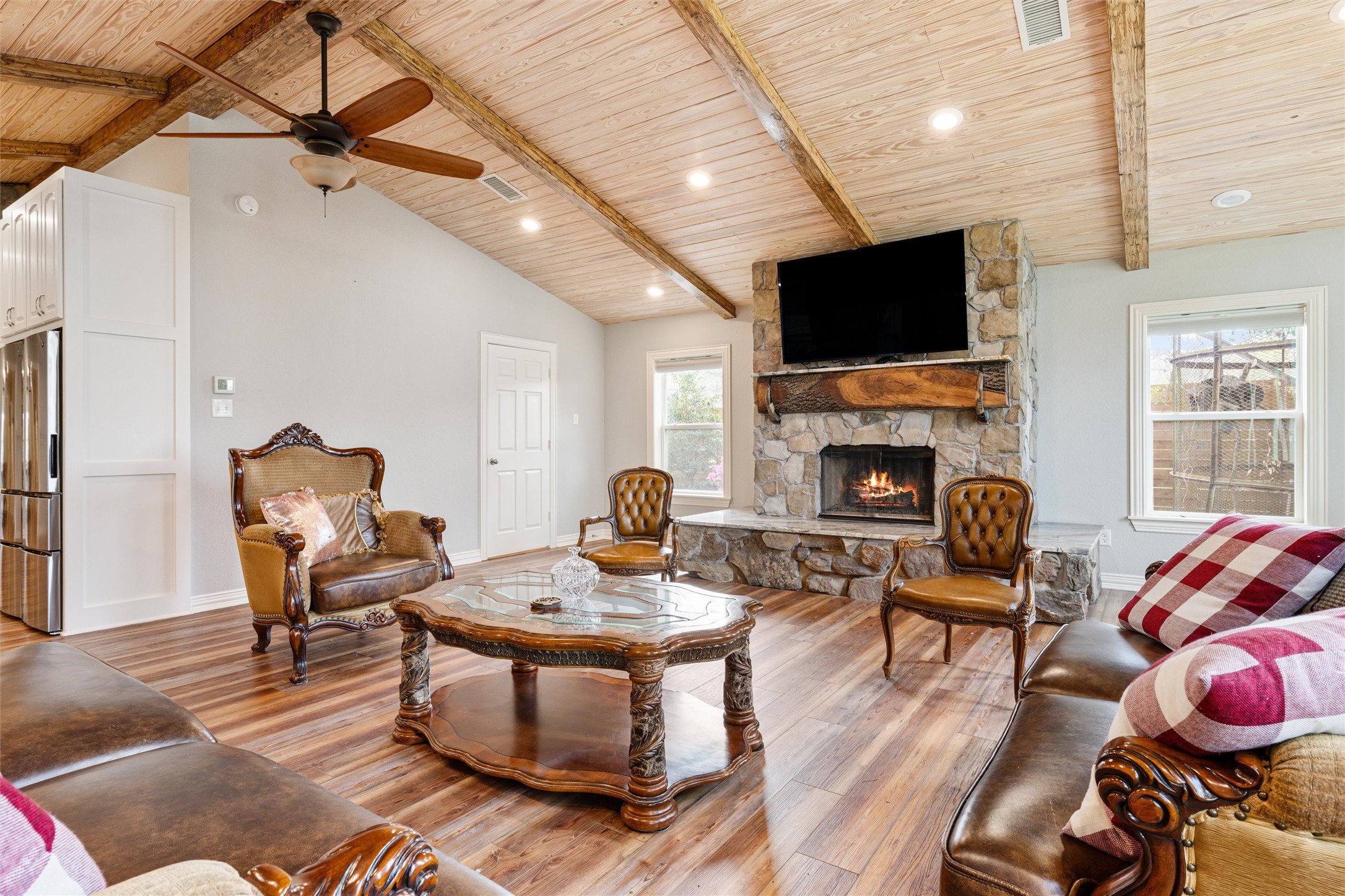 10602 Ward Road Tomball, TX 77375 - Photo 41 of 50 a living room with furniture a fireplace and a flat screen tv