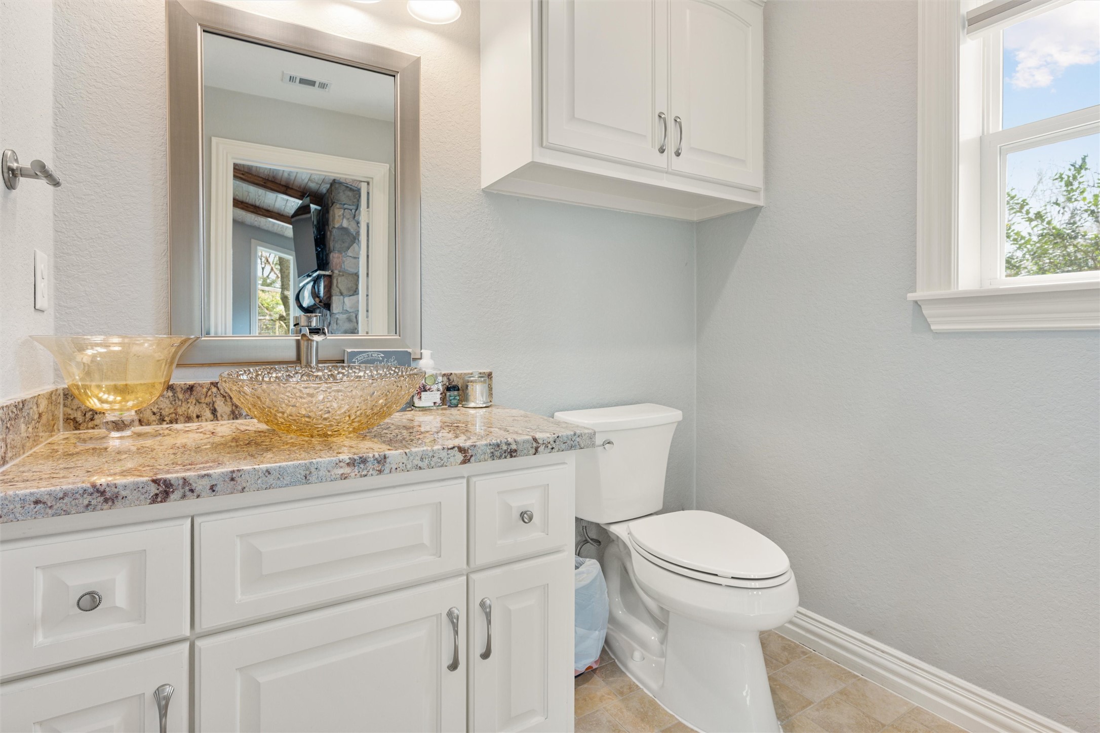 10602 Ward Road Tomball, TX 77375 - Photo 43 of 50 a bathroom with a granite countertop toilet sink mirror and vanity