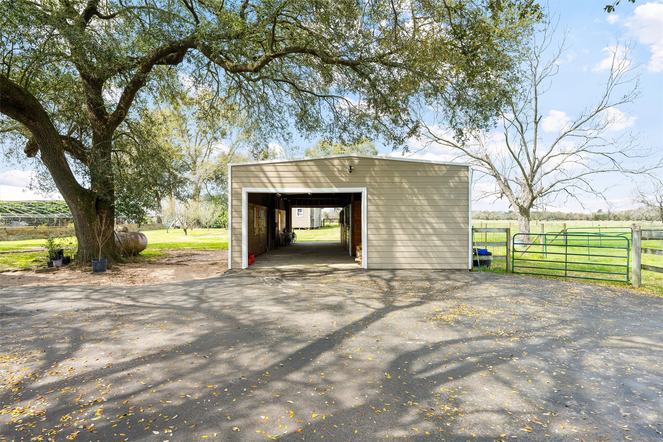 10602 Ward Road Tomball, TX 77375 - Photo 45 of 50 a view of a house with a yard and garage