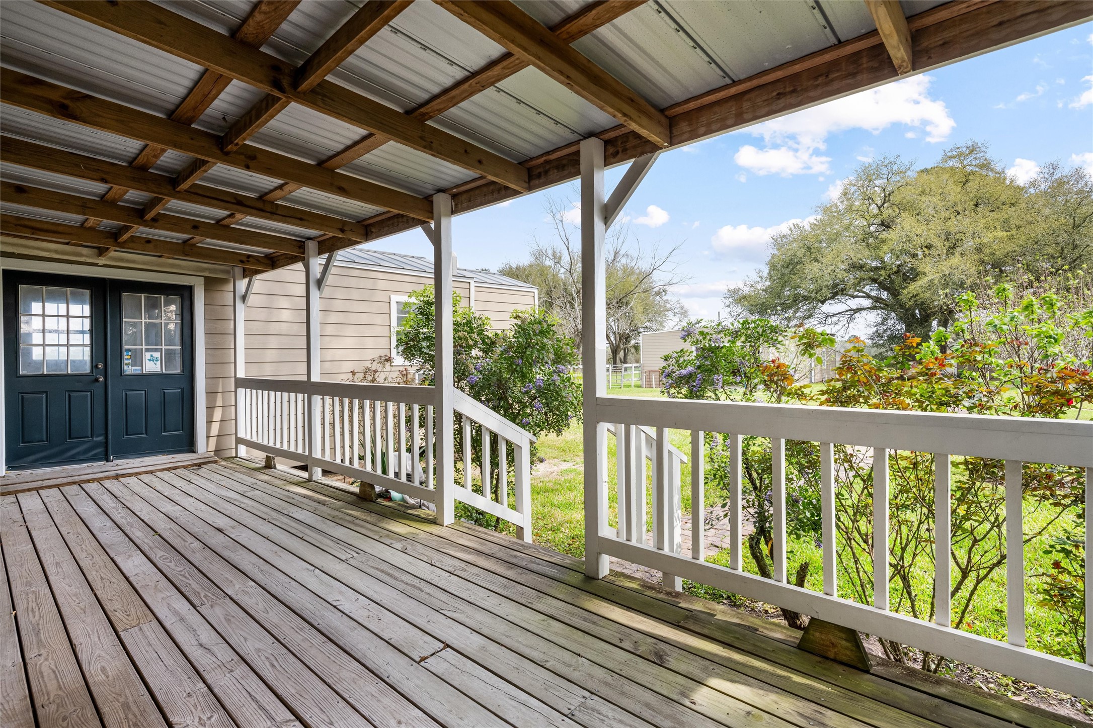 10602 Ward Road Tomball, TX 77375 - Photo 48 of 50 a view of porch with wooden floor