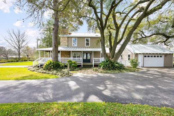 a view of livingroom with furniture wooden floor and windows