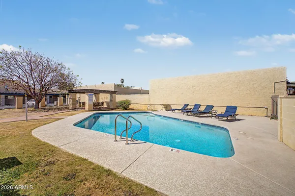 a view of a swimming pool with an ocean view