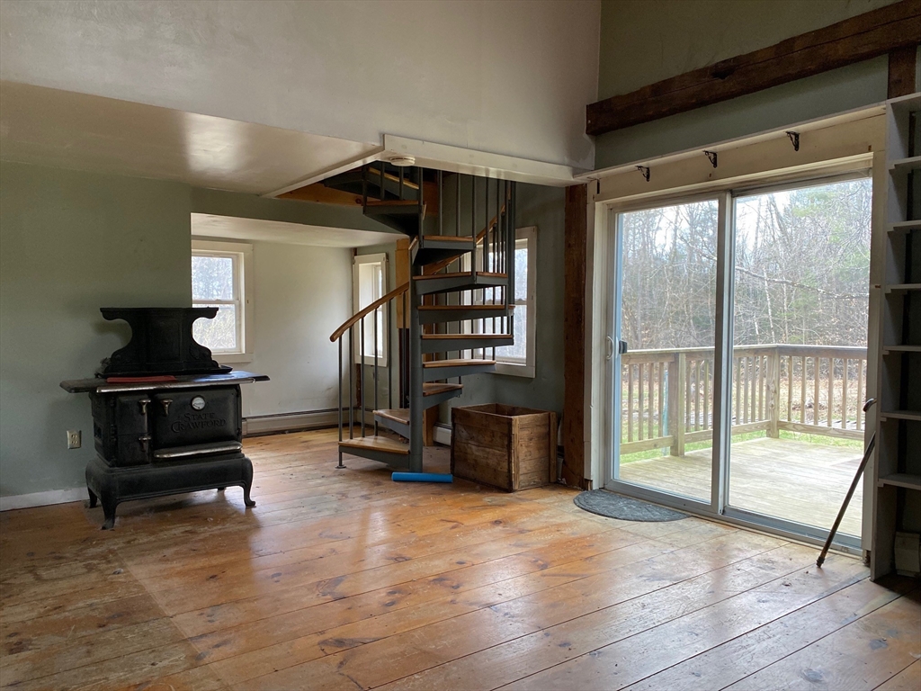 142 Flower Hill Road Warwick, MA 01378 - Photo 15 of 35 a bedroom with furniture and a window