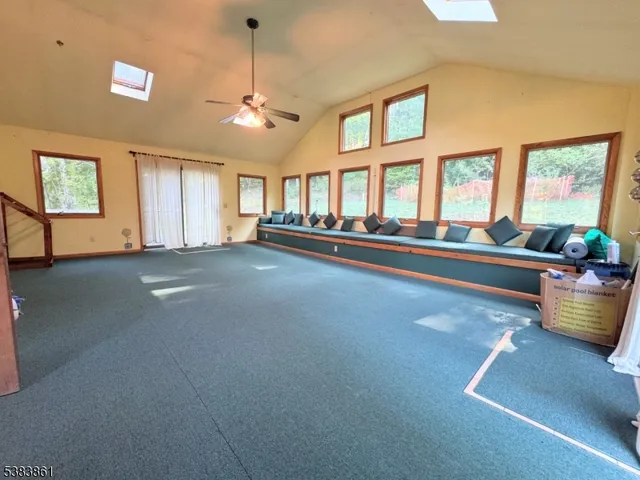 a view of a livingroom with furniture and windows