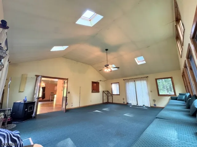 a living room with couches and painted walls