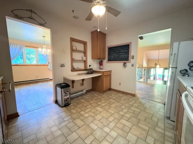 a kitchen with stainless steel appliances a sink and a refrigerator