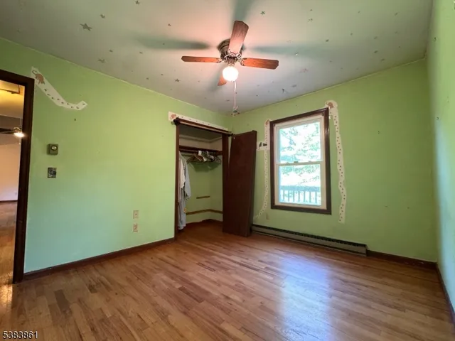 a view of a livingroom with furniture and a window