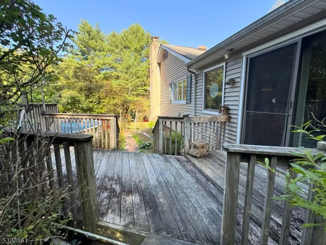 a view of a wooden door and a yard