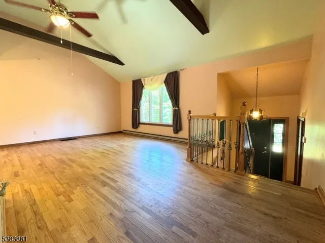 a view of a livingroom with furniture nad wooden floor