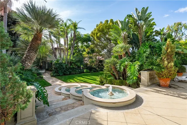 a backyard of a house with a table and chairs