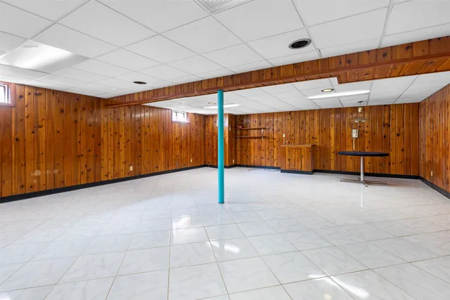 a view of a room with wooden walls
