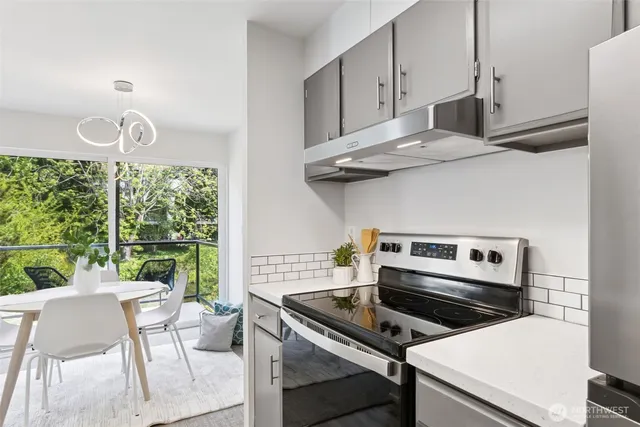a kitchen with a stove and a microwave