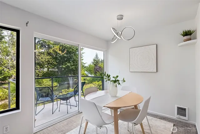 a view of a dining room with furniture window and outside view