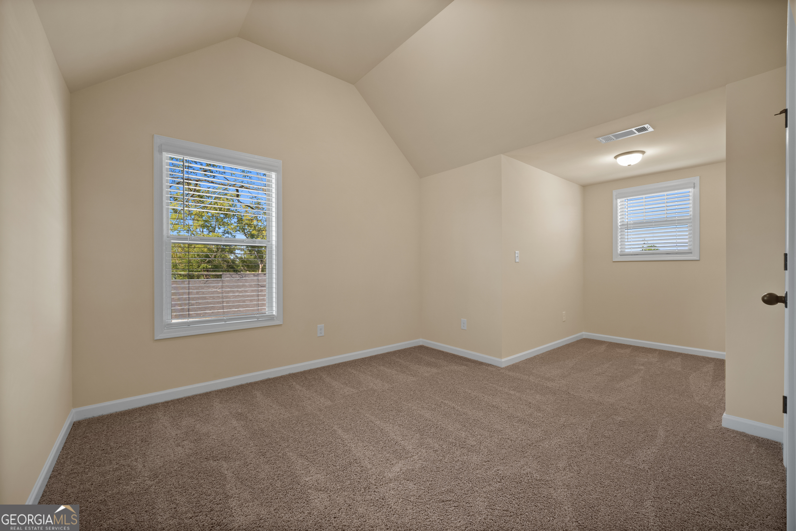 2381 Aukerman Trace, Unit 81 Hampton, GA 30228 - Photo 11 of 17 an empty room with a window