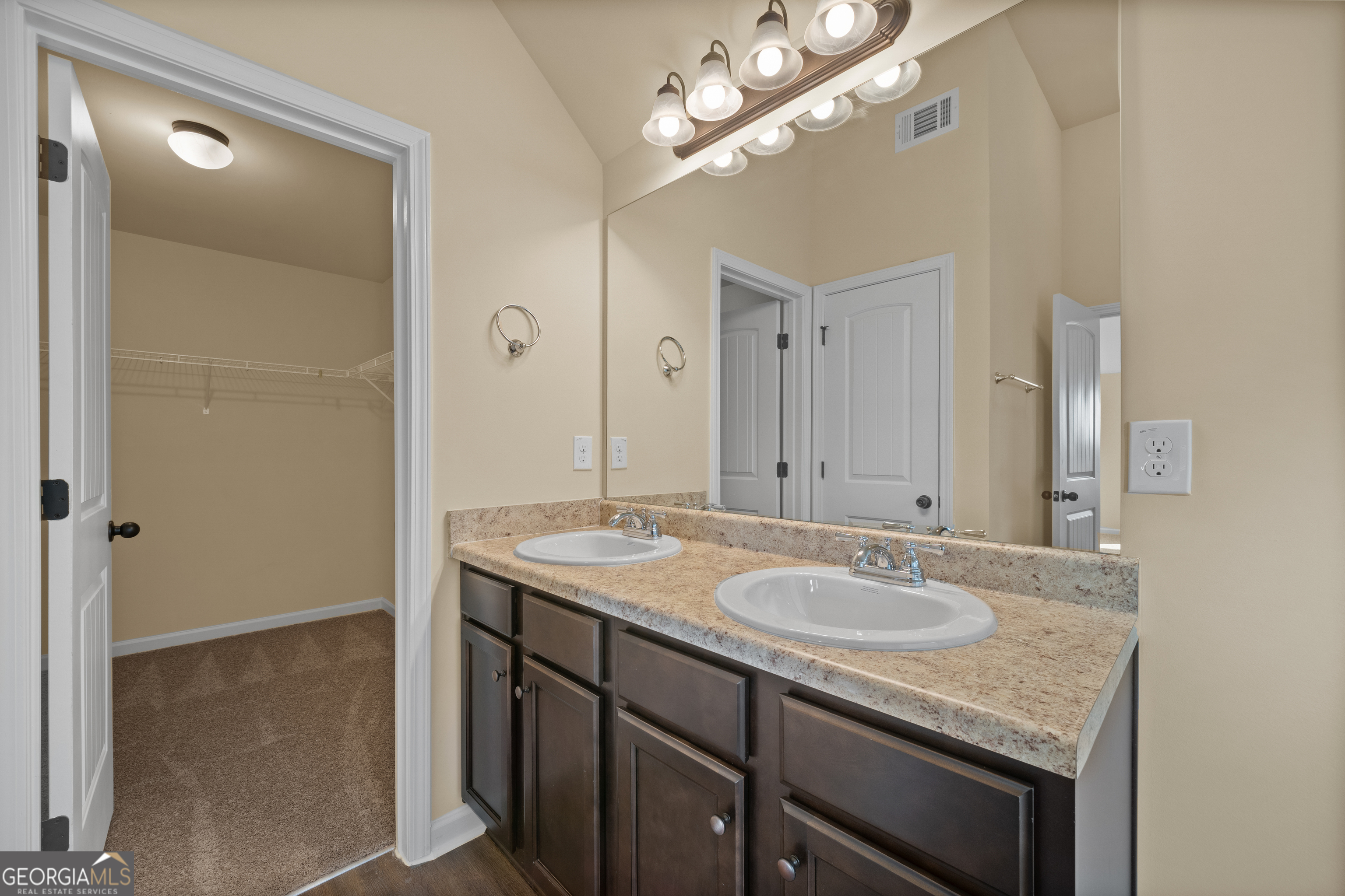 2381 Aukerman Trace, Unit 81 Hampton, GA 30228 - Photo 15 of 17 a bathroom with a granite countertop sink a mirror and a shower