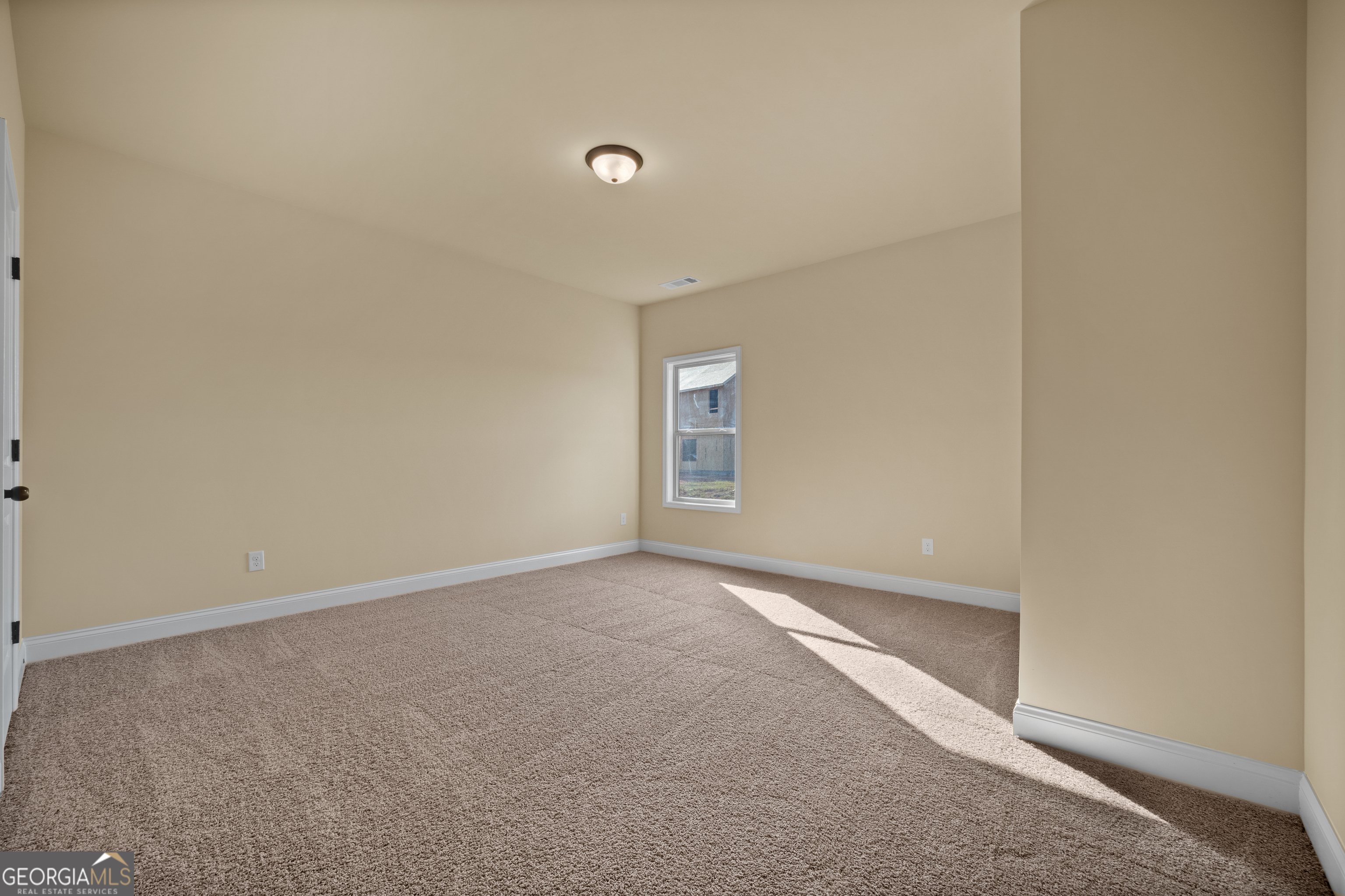 2381 Aukerman Trace, Unit 81 Hampton, GA 30228 - Photo 9 of 17 a view of an empty room