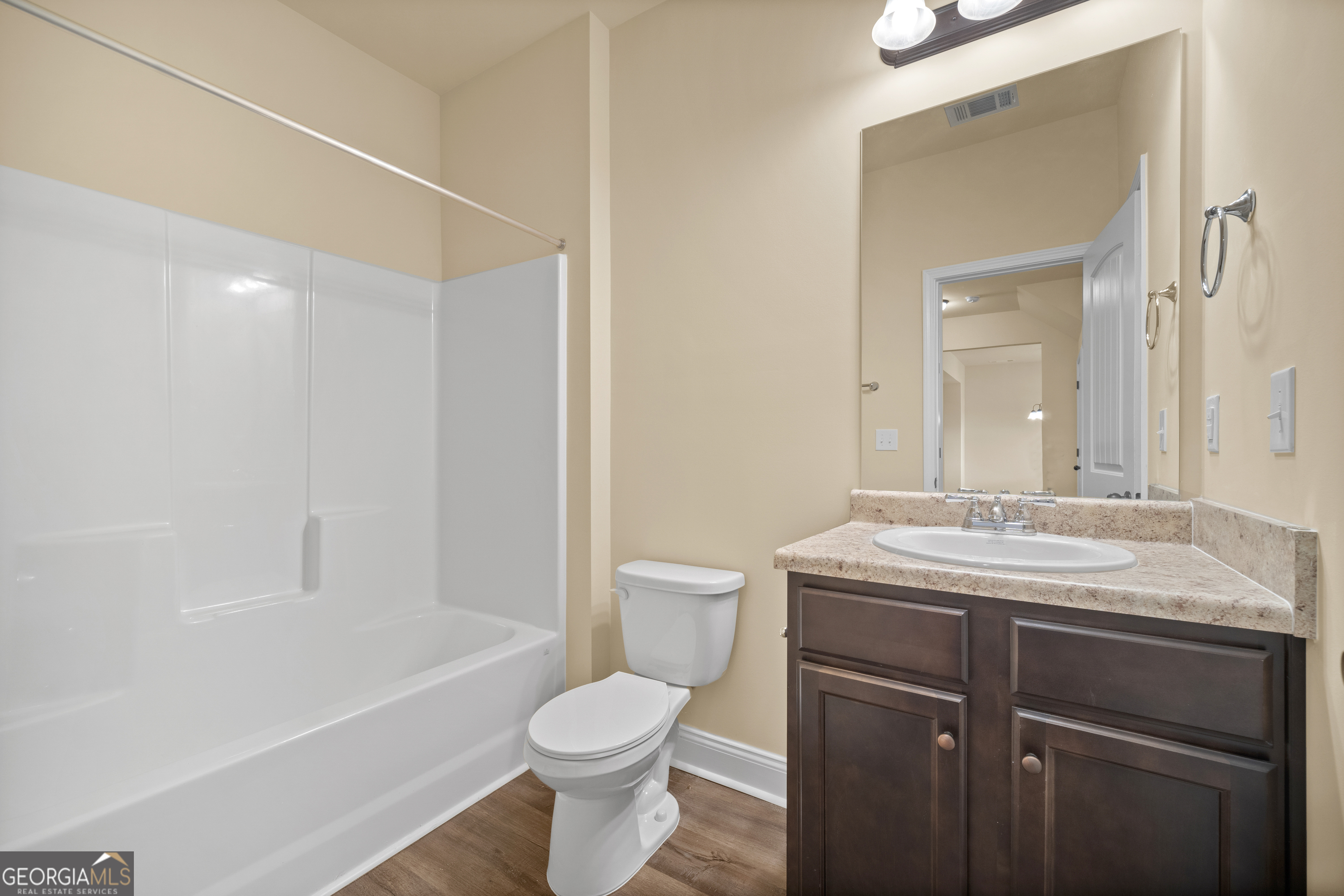 2381 Aukerman Trace, Unit 81 Hampton, GA 30228 - Photo 10 of 17 a bathroom with a granite countertop sink toilet and shower