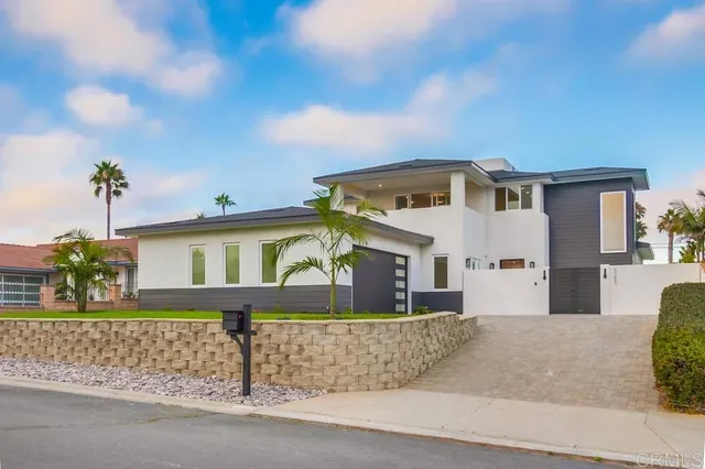 a front view of a house with a garage