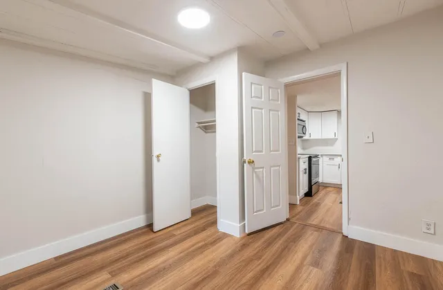 a view of entryway with wooden floor