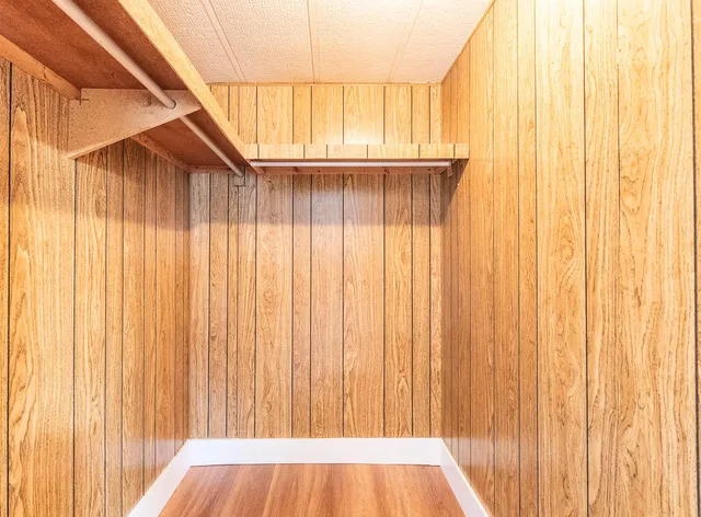 a view of wooden floor and windows