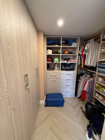 a bathroom with a sink a toilet a mirror and shower